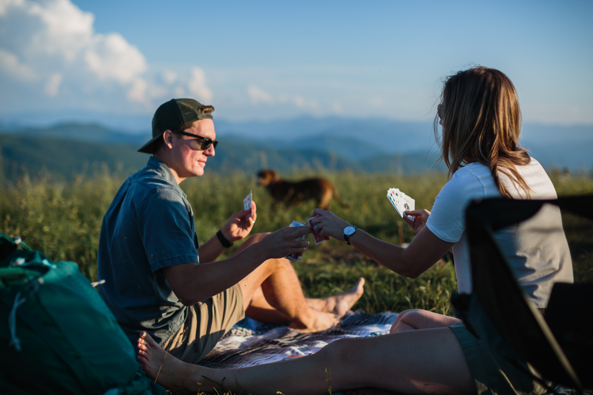 couple playing cards on max patch, couples mountain, mountain engagement, couples camping, dog photography, Knoxville, couples hiking, camping with dog, North Carolina hiking, summer engagement photos, Tennessee Photography, Tennessee Photographer, Tennessee Photos, Tennessee Engagement Photography, Tennessee Engagement Photos, Tennessee Engagement Photographer, Tennessee Portrait Photographer, Knoxville Engagement, Creative Portraits