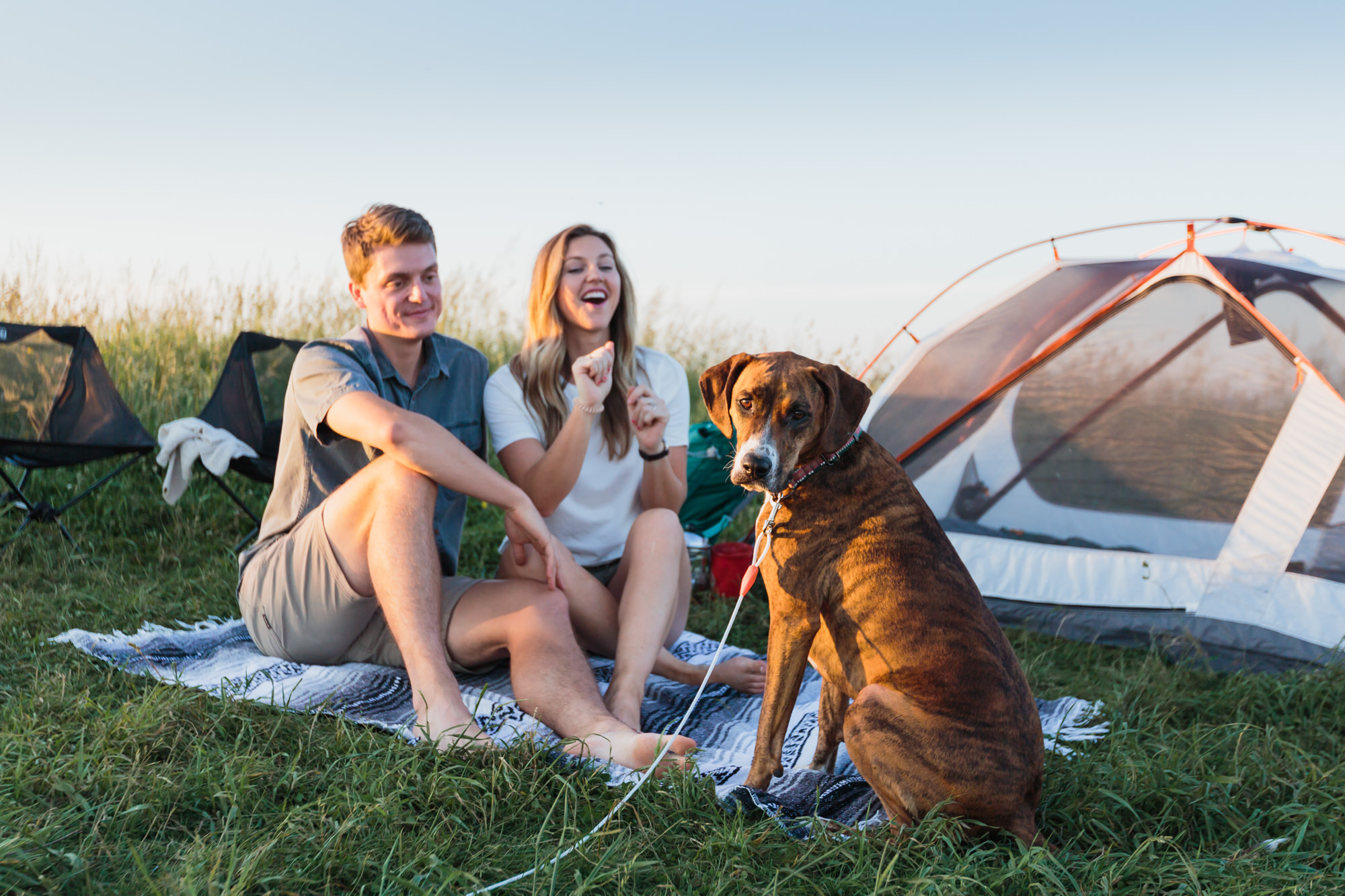 Guy and girl on blanket by tent with dog sitting in front, Nashville engagement, couples mountain, mountain engagement, couples camping, dog photography, Knoxville, couples hiking, camping with dog, North Carolina hiking, summer engagement photos, Tennessee Photography, Tennessee Photographer, Tennessee Photos, Tennessee Engagement Photography, Tennessee Engagement Photos, Tennessee Engagement Photographer, Tennessee Portrait Photographer, Nashville Engagement Photographer, Nashville Engagement Photos, Knoxville Engagement, Nashville Lifestyle Photographer, Nashville Lifestyle Photography, Nashville Lifestyle Photos, Creative Portraits