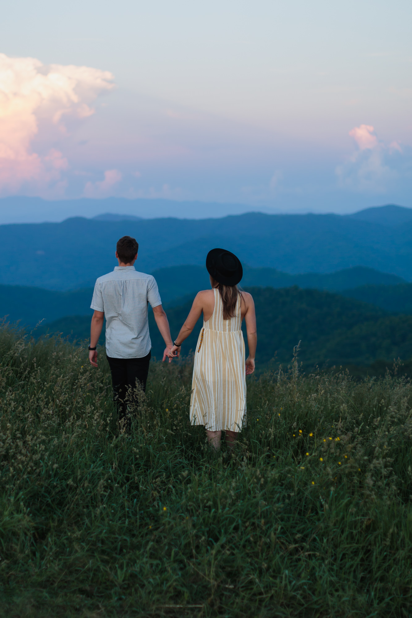 couple holding hands looking out at mountain sunset, Nashville engagement, couples mountain, mountain engagement, couples camping, dog photography, Knoxville, couples hiking, camping with dog, North Carolina hiking, summer engagement photos, Tennessee Photography, Tennessee Photographer, Tennessee Photos, Tennessee Engagement Photography, Tennessee Engagement Photos, Tennessee Engagement Photographer, Tennessee Portrait Photographer, Nashville Engagement Photographer, Nashville Engagement Photos, Knoxville Engagement, Nashville Lifestyle Photographer, Nashville Lifestyle Photography, Nashville Lifestyle Photos, Creative Portraits