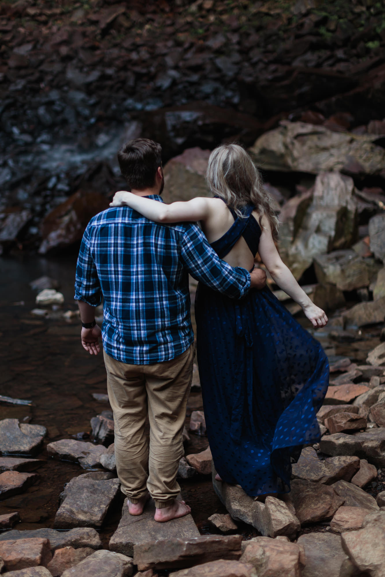 fall creek falls engagement session backside arm around neck at waterfall